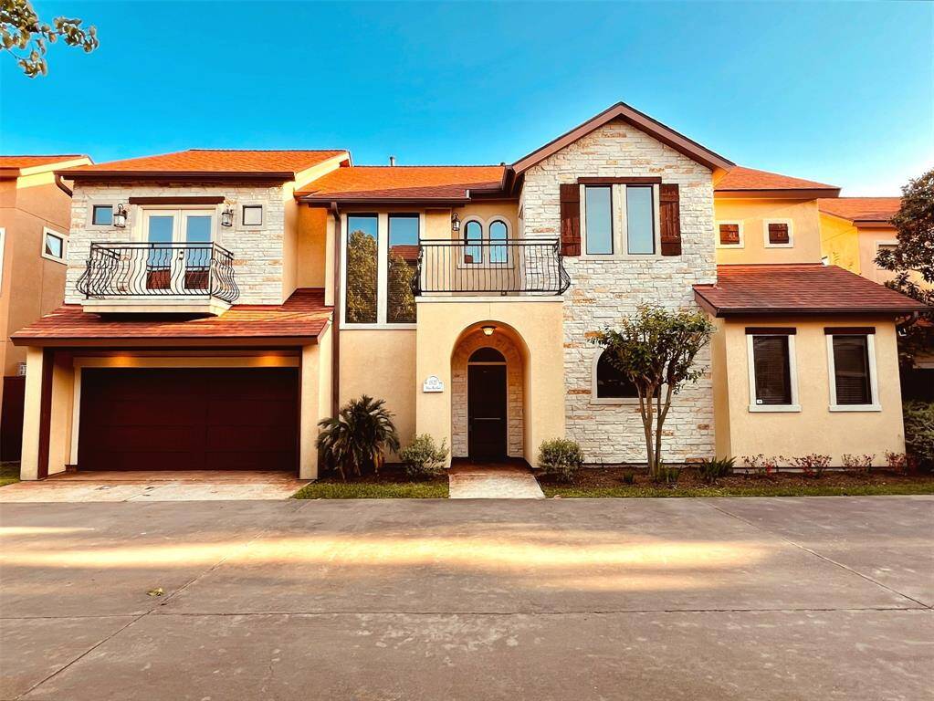 This Mediterranean-style patio home offers a blend of elegance and comfort, tucked in a private, gated community.