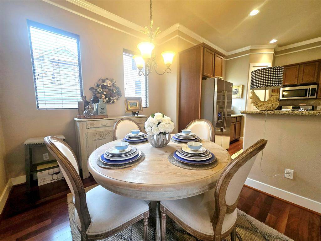 Another view of the breakfast area, offering a cozy and inviting spot to enjoy your morning coffee or casual meals.