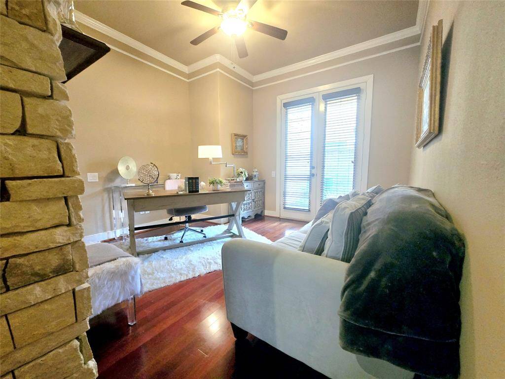 The study is adorned with gorgeous double doors that lead to an outdoor retreat, offering the perfect spot for well-deserved breaks and relaxation.