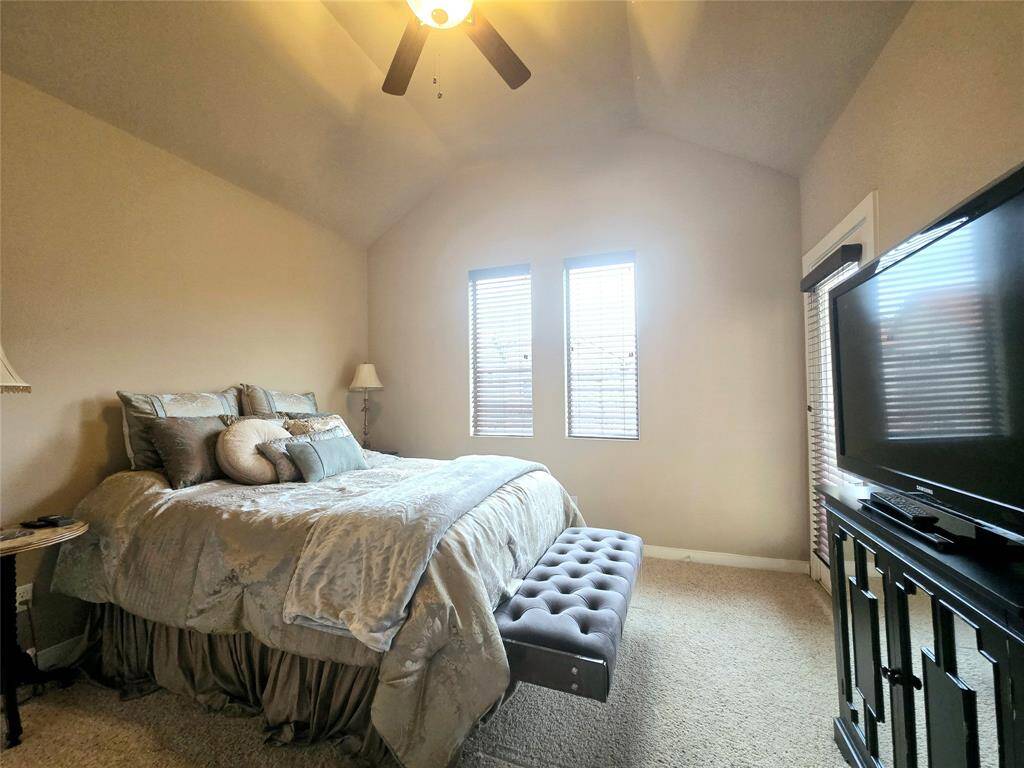 The secondary bedroom is generously sized, offering plenty of space for comfort and versatility.