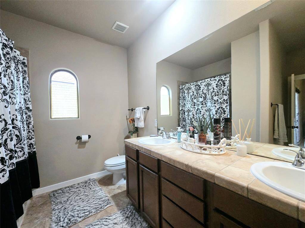 Spacious secondary bath, offering plenty of room and comfort, perfect for family or guests.