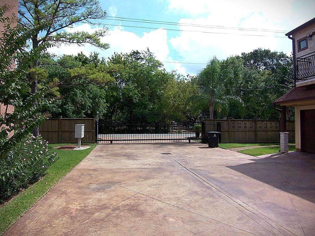 Securely gated with access codes, providing peace of mind and privacy to the residence.