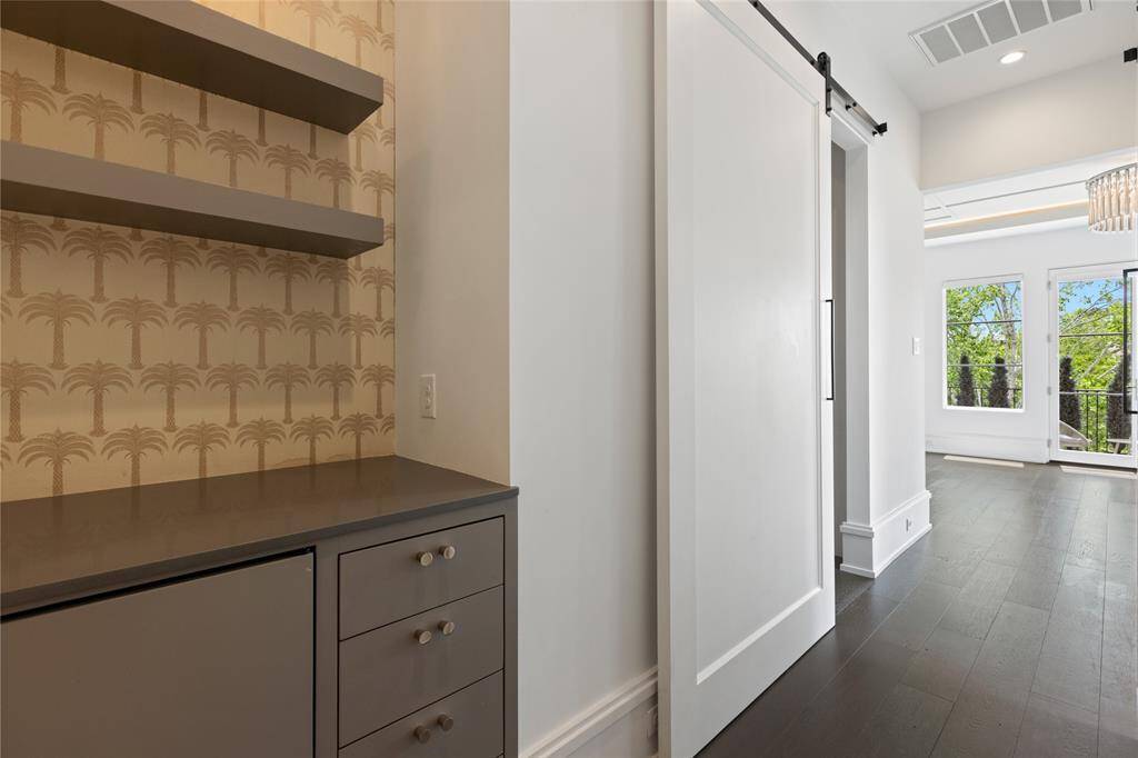 Coffee bar in primary bedroom with mini fridge