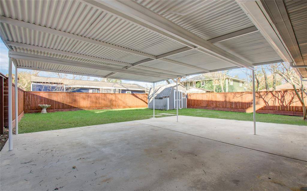 Grand backyard with extended patio cover.