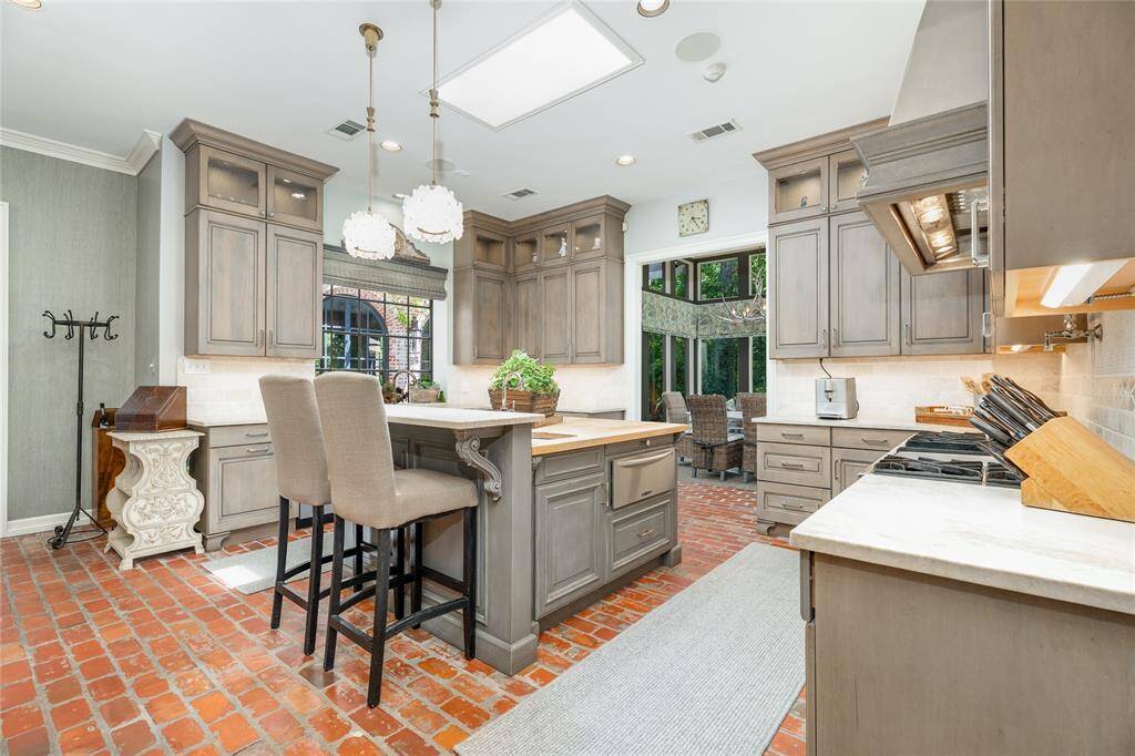 Enjoy the natural lighting that pours in as you gather around in the breakfast room.