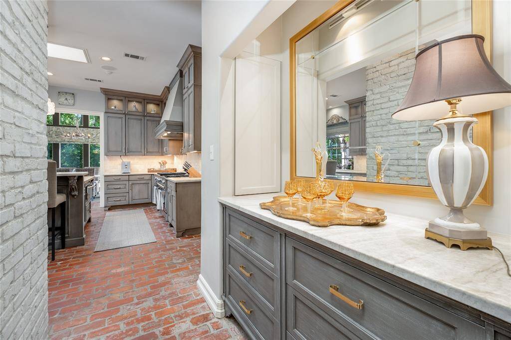 Notice the Knotty Pine Paneling in the Family Room, wonderfully complimenting the many arched entryways!