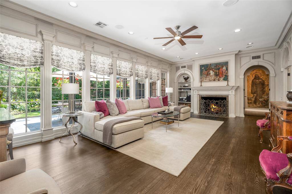 Notice the Knotty Pine Paneling in the Family Room, wonderfully complimenting the many arched entryways!