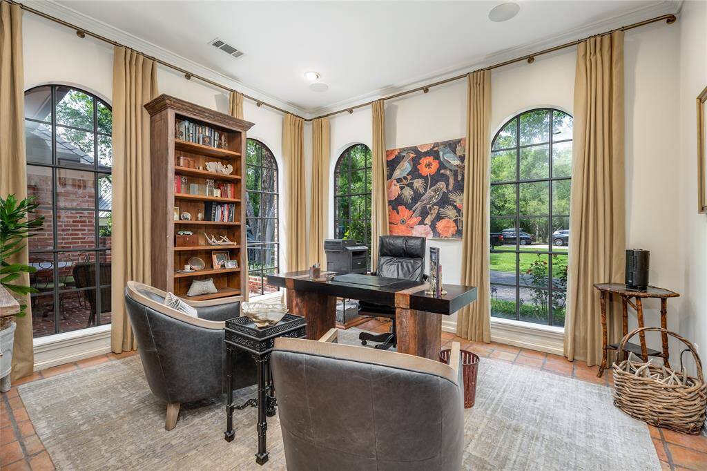 This space is versatile serving as a sitting area/ office.