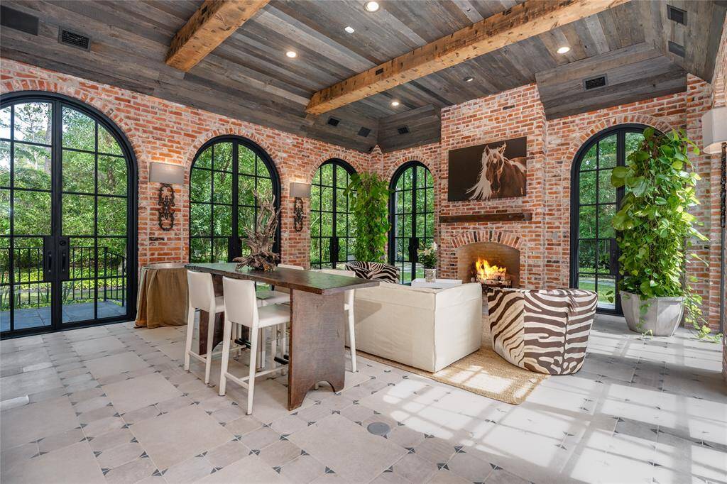 This Outdoor Livingroom is surrounded by Outdoor Spaces, making it a focal point to the home.