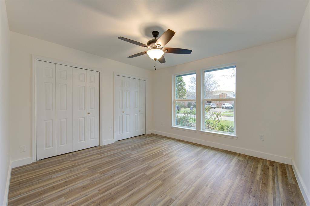 The three additional bedrooms are spacious and feature the same luxury vinyl flooring and natural light as the rest of the home. These rooms are freshly painted and offer versatility for use as bedrooms, home offices, or playrooms. Updated lighting and modern trim further enhance the updated look.