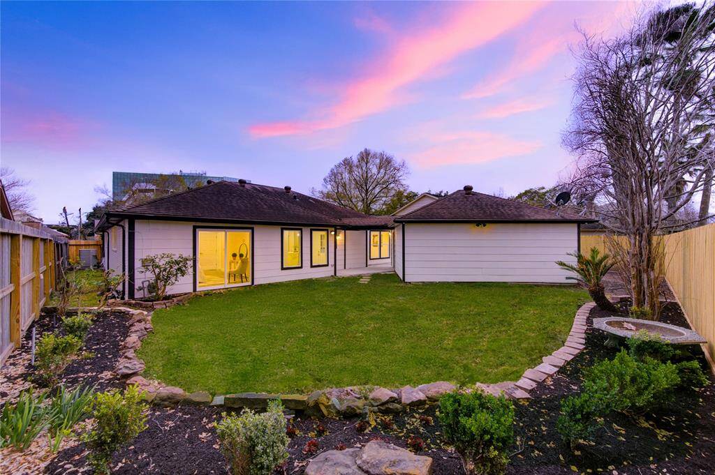 The backyard provides ample space for outdoor activities, with a large, open area perfect for creating your ideal outdoor retreat. The freshly landscaped yard complements the updated interior of the home, providing a seamless transition between indoor and outdoor living.