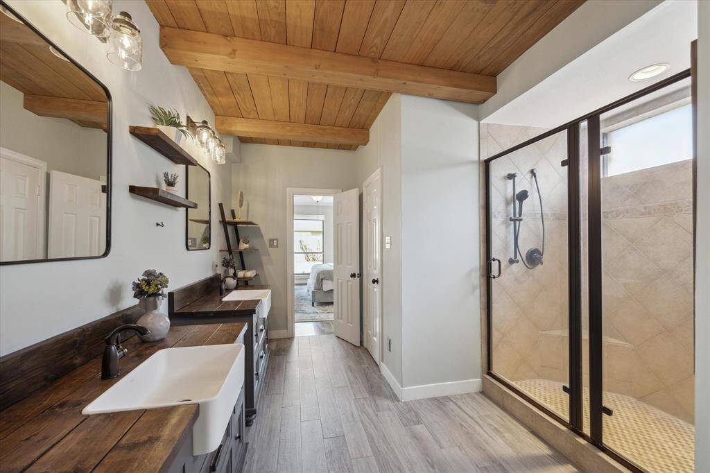 The centerpiece is a spacious walk-in shower for a spa-like experience. The suite also includes two walk-in closets.