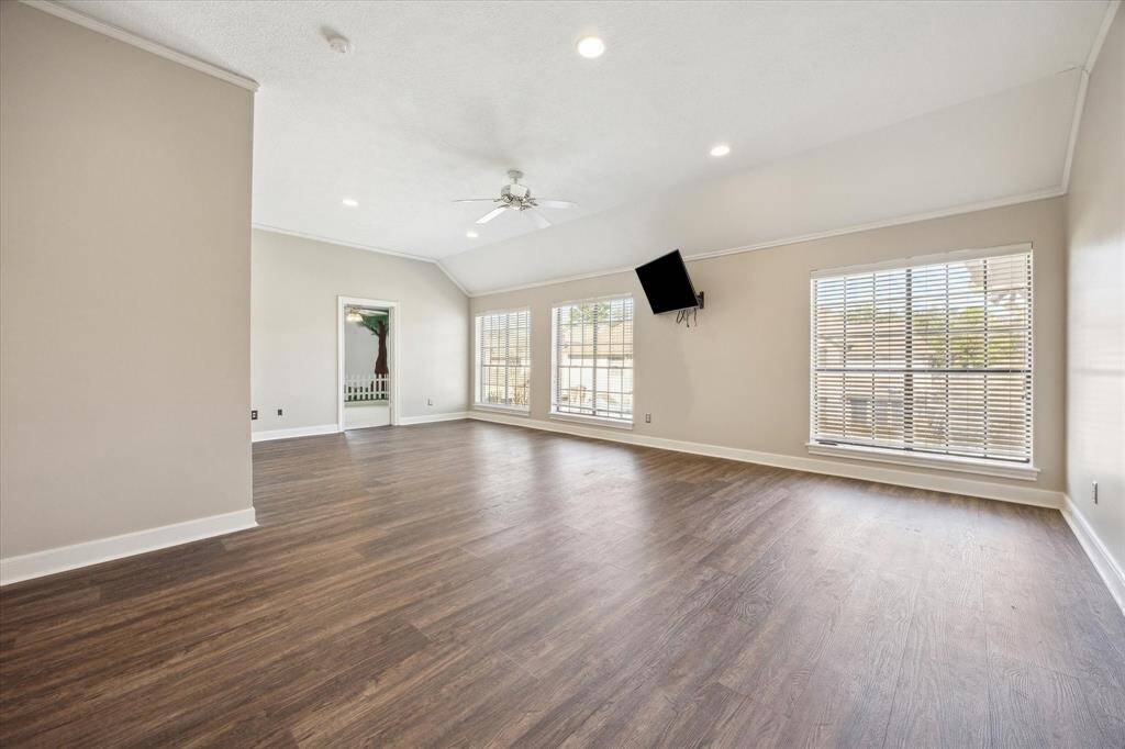 Upstairs, a spacious flex room offers endless possibilities—perfect as a game room, media retreat, or home office.