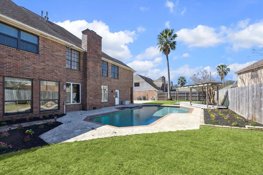 A mature palm tree, along with the recent landscaping lends a touch of tropical elegance, enhancing the appeal of this desirable residence.