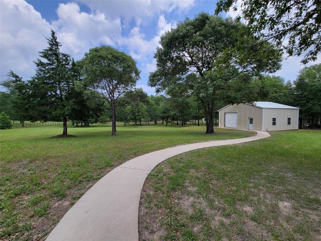 Concrete walkway to storage barn