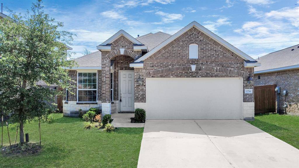 Charming single-story brick home with a two-car garage and a well-maintained front yard. Features a welcoming arched entryway and a clean, modern design. Perfect for comfortable family living.