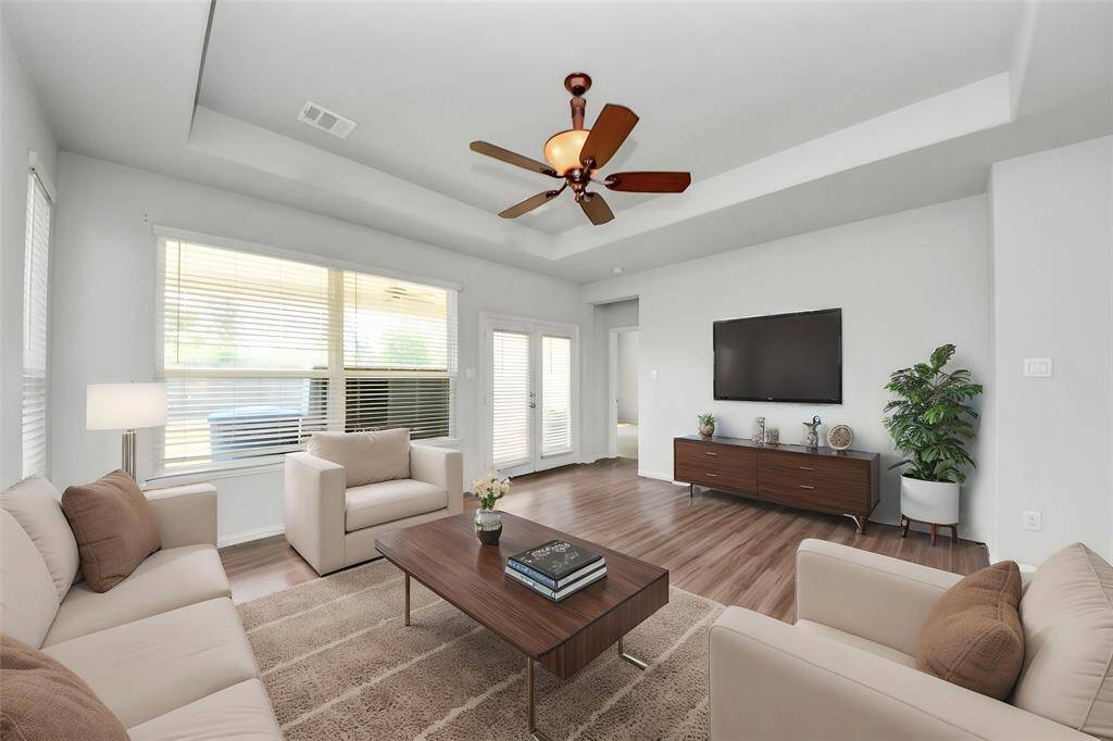 Charming single-story brick home with a two-car garage and a well-maintained front yard. Features a welcoming arched entryway and a clean, modern design. Perfect for comfortable family living.