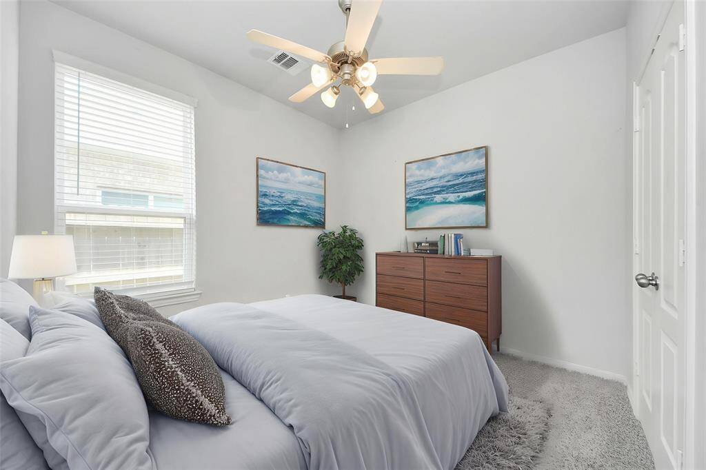 Charming single-story brick home with a two-car garage and a well-maintained front yard. Features a welcoming arched entryway and a clean, modern design. Perfect for comfortable family living.