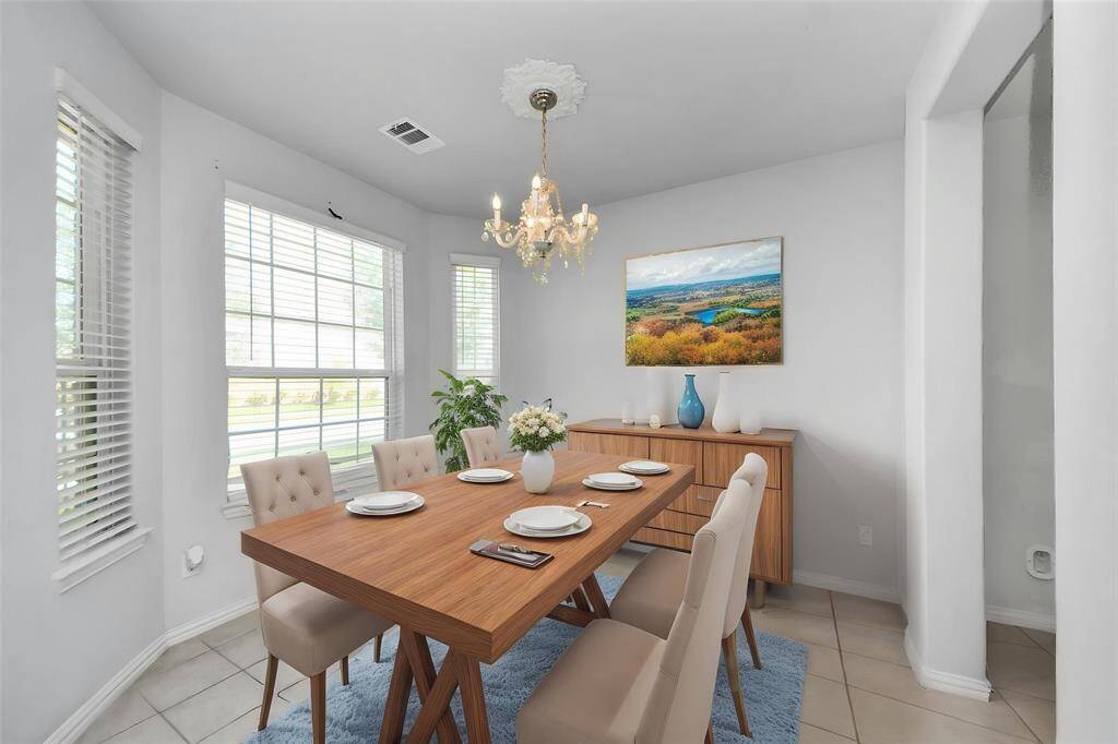 Charming single-story brick home with a two-car garage and a well-maintained front yard. Features a welcoming arched entryway and a clean, modern design. Perfect for comfortable family living.