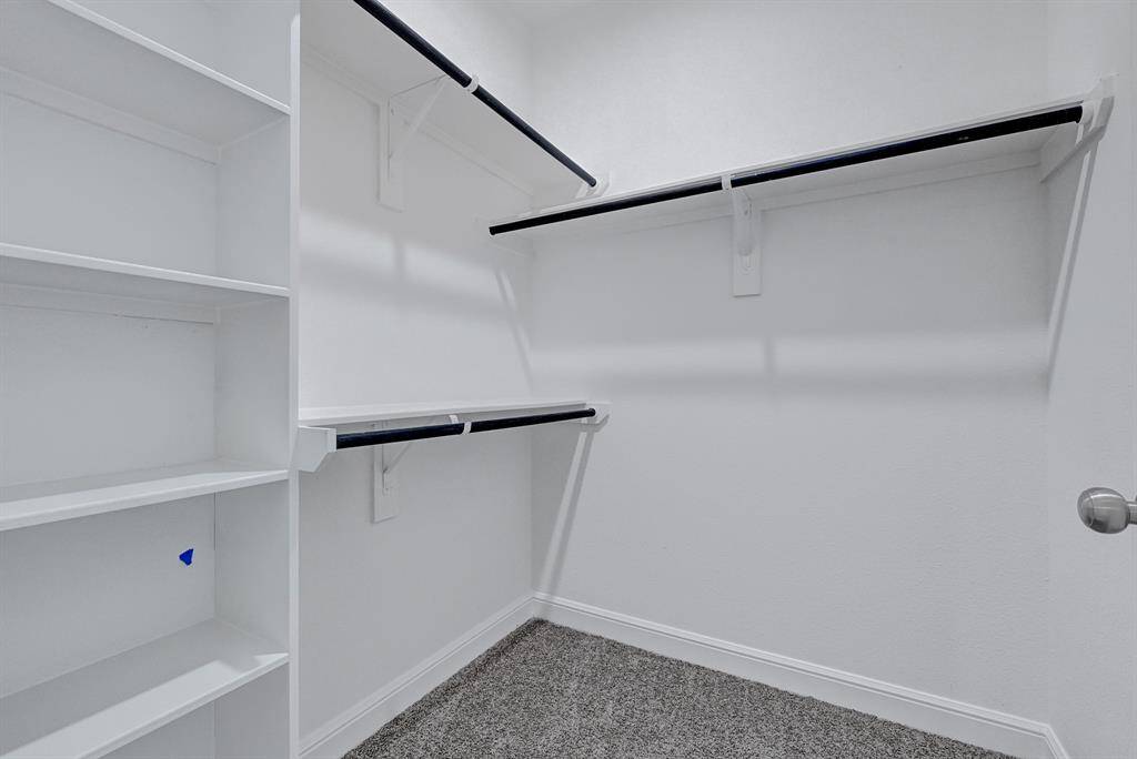 Generous walk-in closet offering excellent storage space.