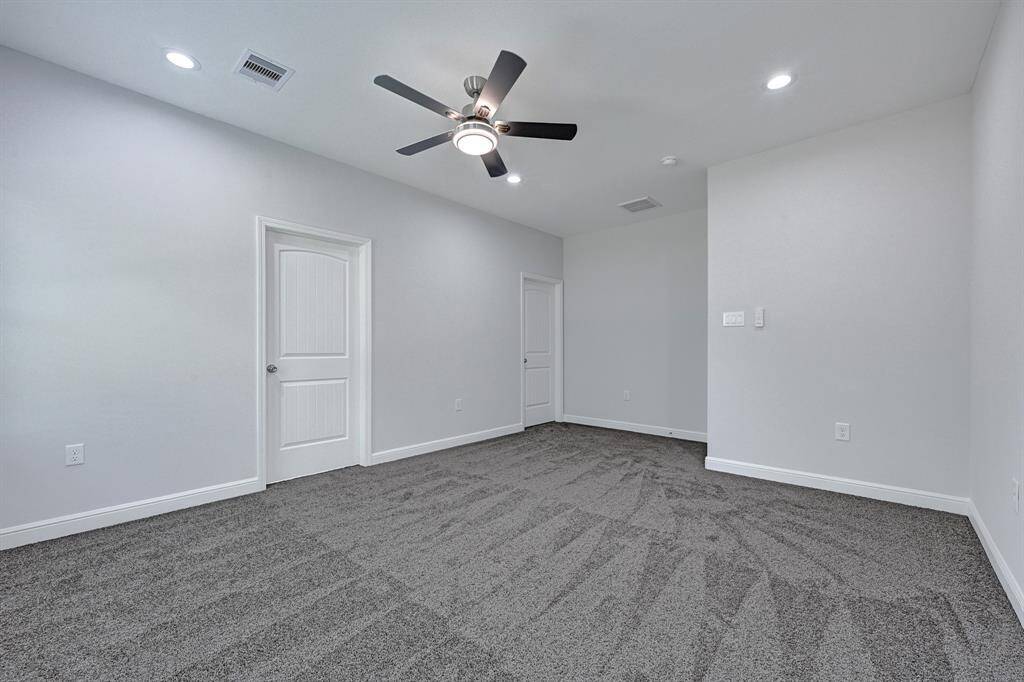 Versatile third bedroom, perfect for a home office or nursery.