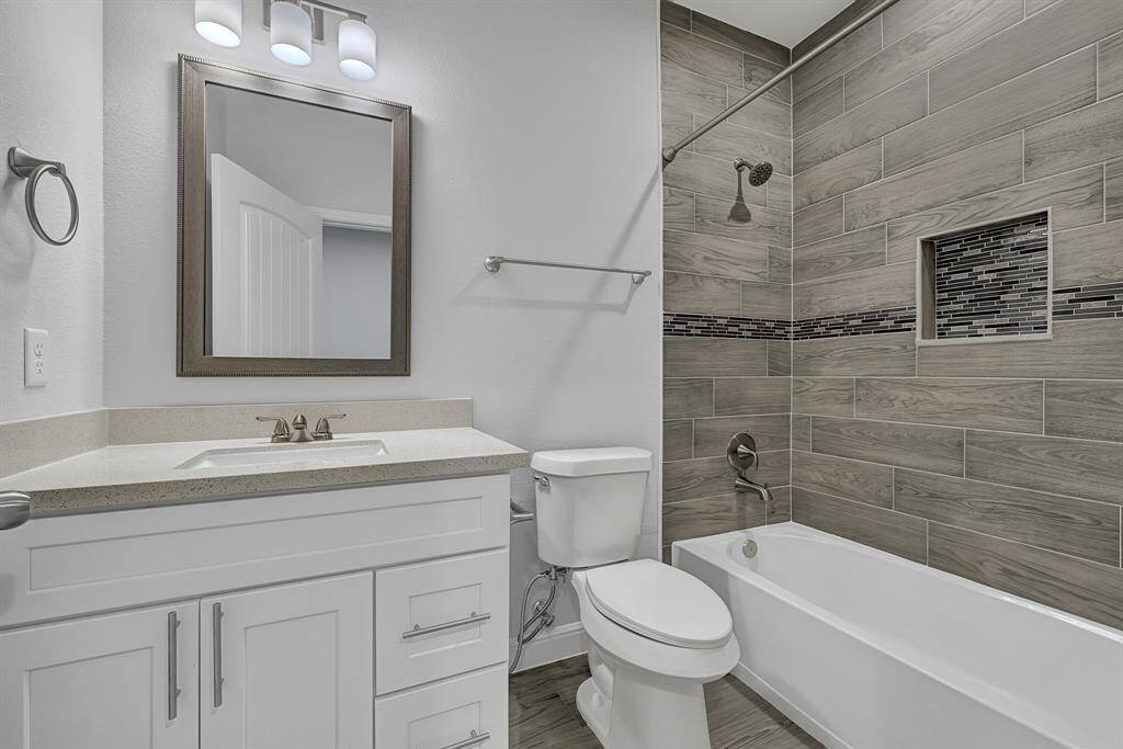 Well-appointed guest bath with contemporary fixtures.