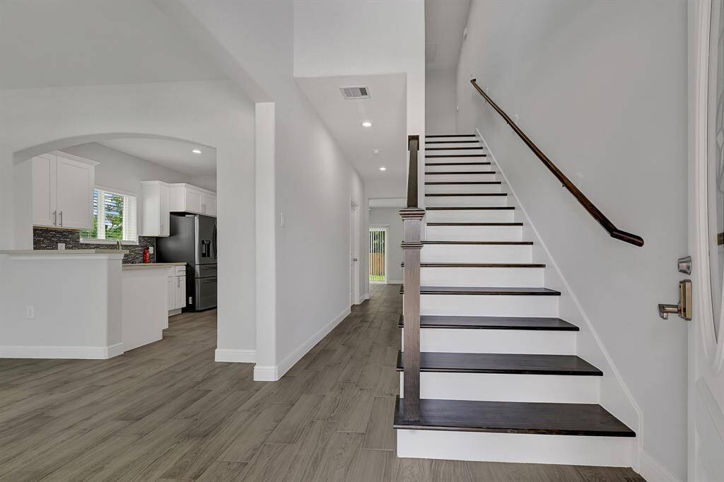 Bright and open foyer offering a warm first impression.