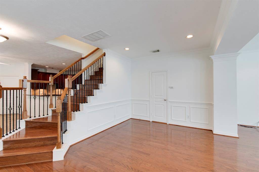 Formal dining room off the living room. Half bath for guests to the right of the stairs.