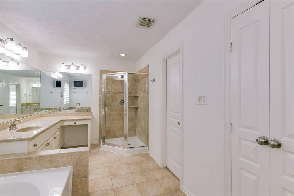Primary bath also has walk-in shower and large walk-in closet to the right. Additional linen closet to the right as well.