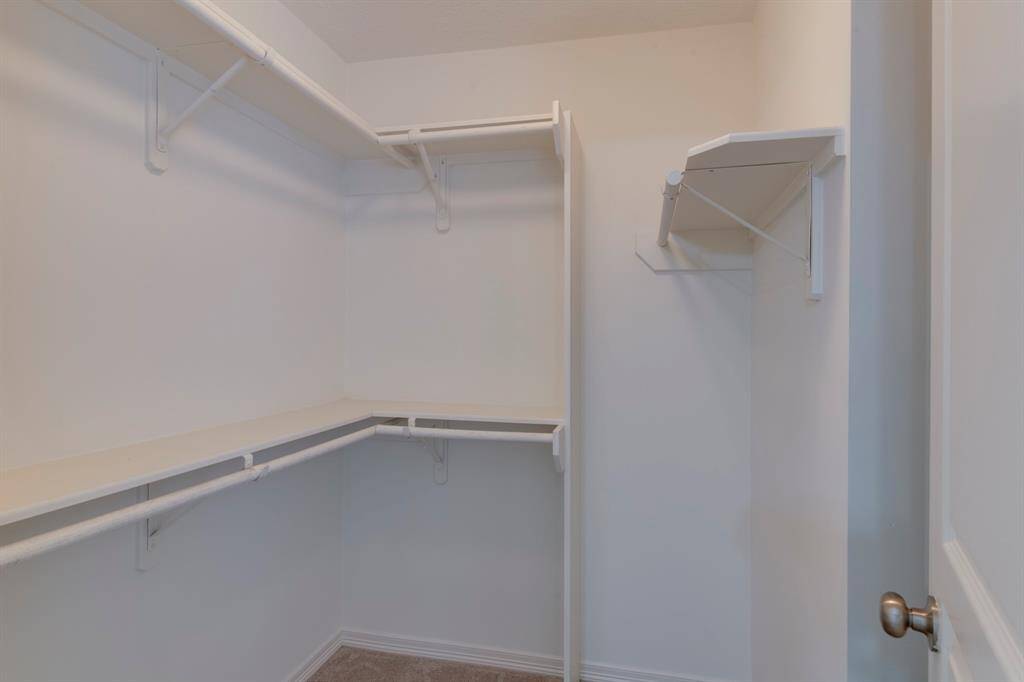 Secondary bedroom walk-in closet.