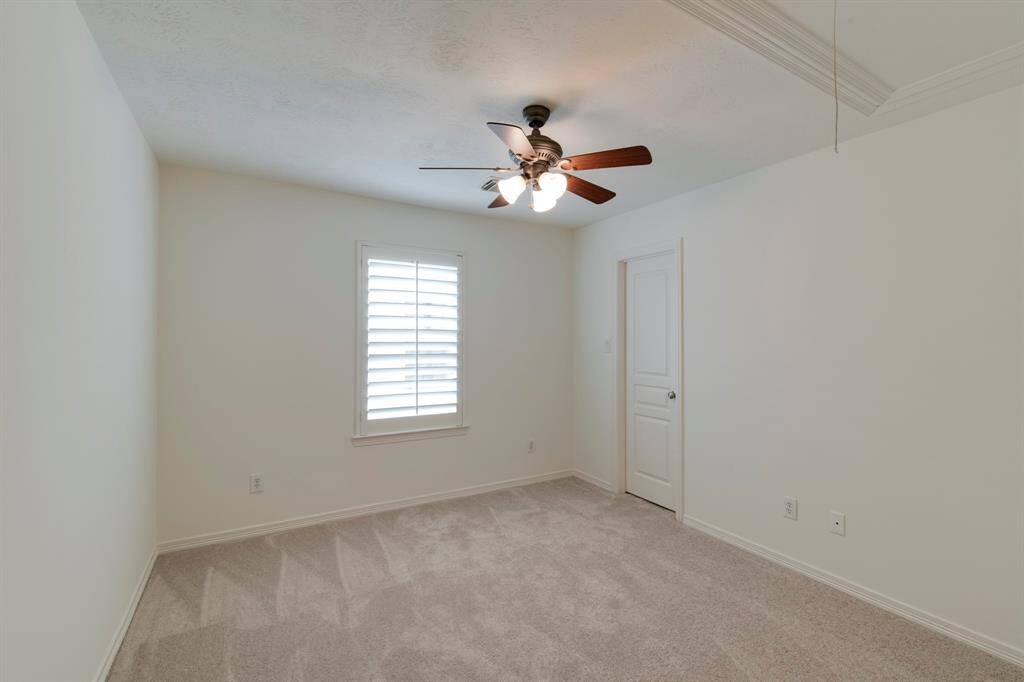 Secondary bedroom off the upstairs game room/living room.