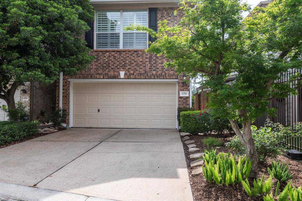 Home has freshly painted garage door (2025)