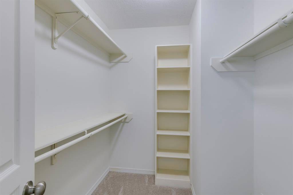 Secondary bedroom walk-in closet.