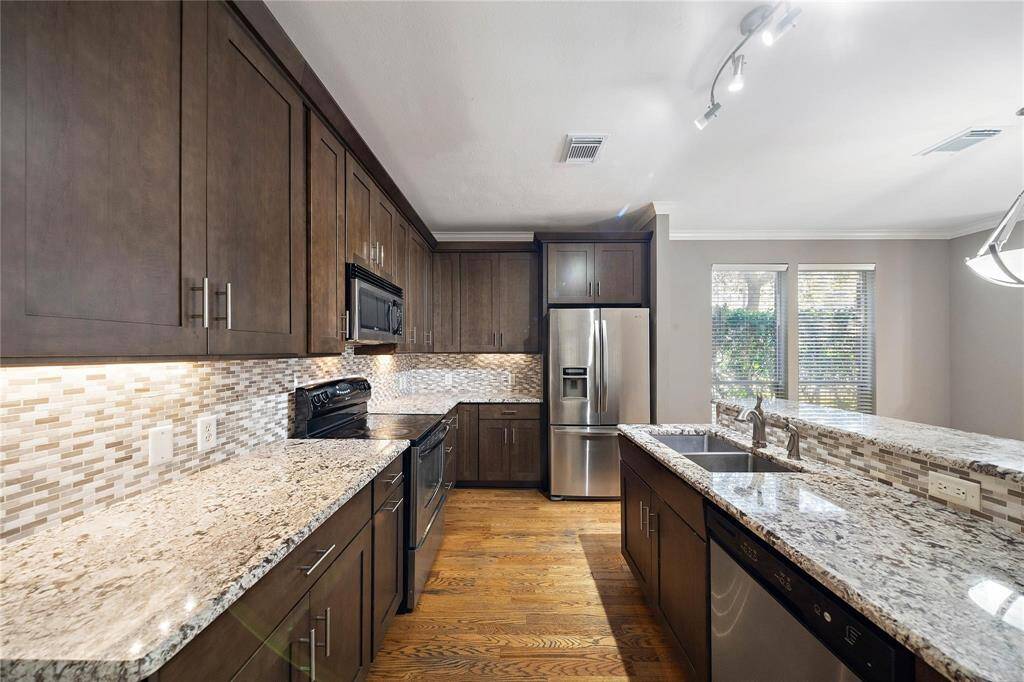 Spacious kitchen boasting ample counter space for culinary creations and gatherings alike