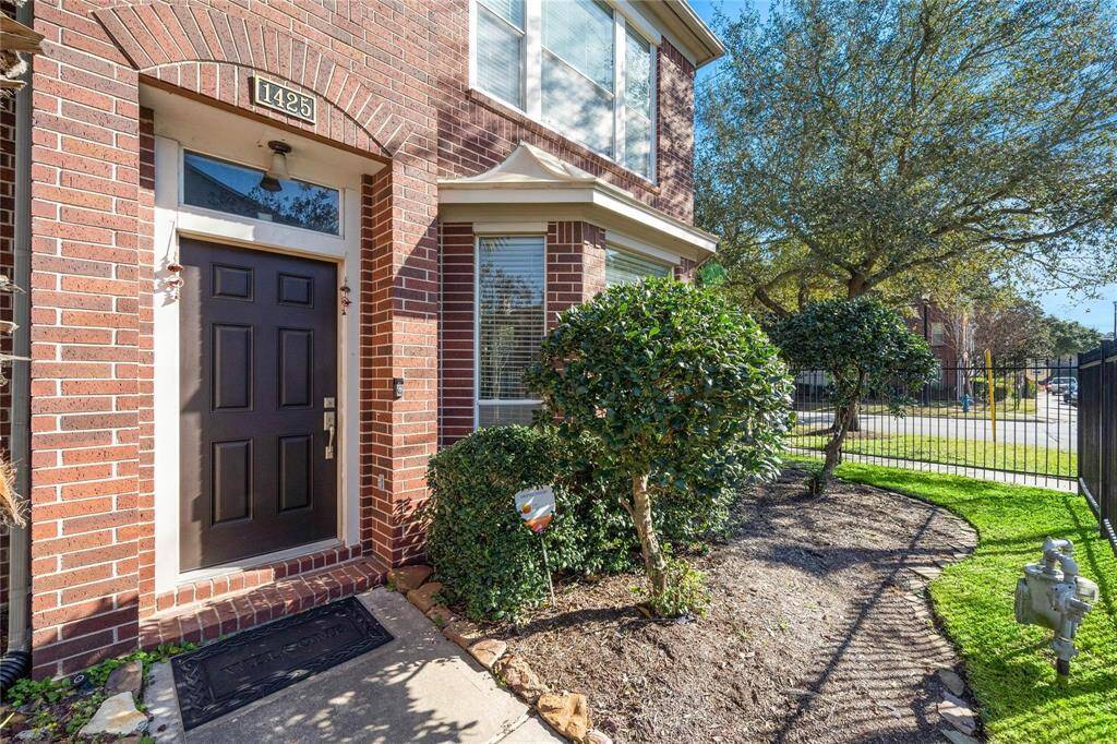 Front of the home adorned with lush landscaping