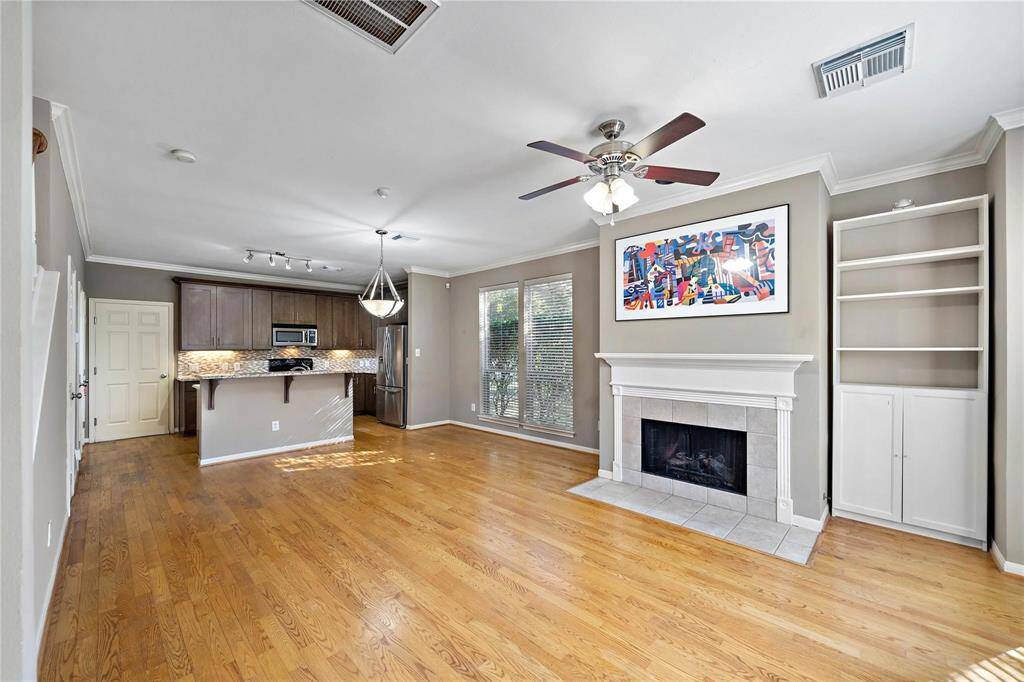 An open-concept living space seamlessly combines the living and dining areas, fostering a sense of spaciousness and connectivity