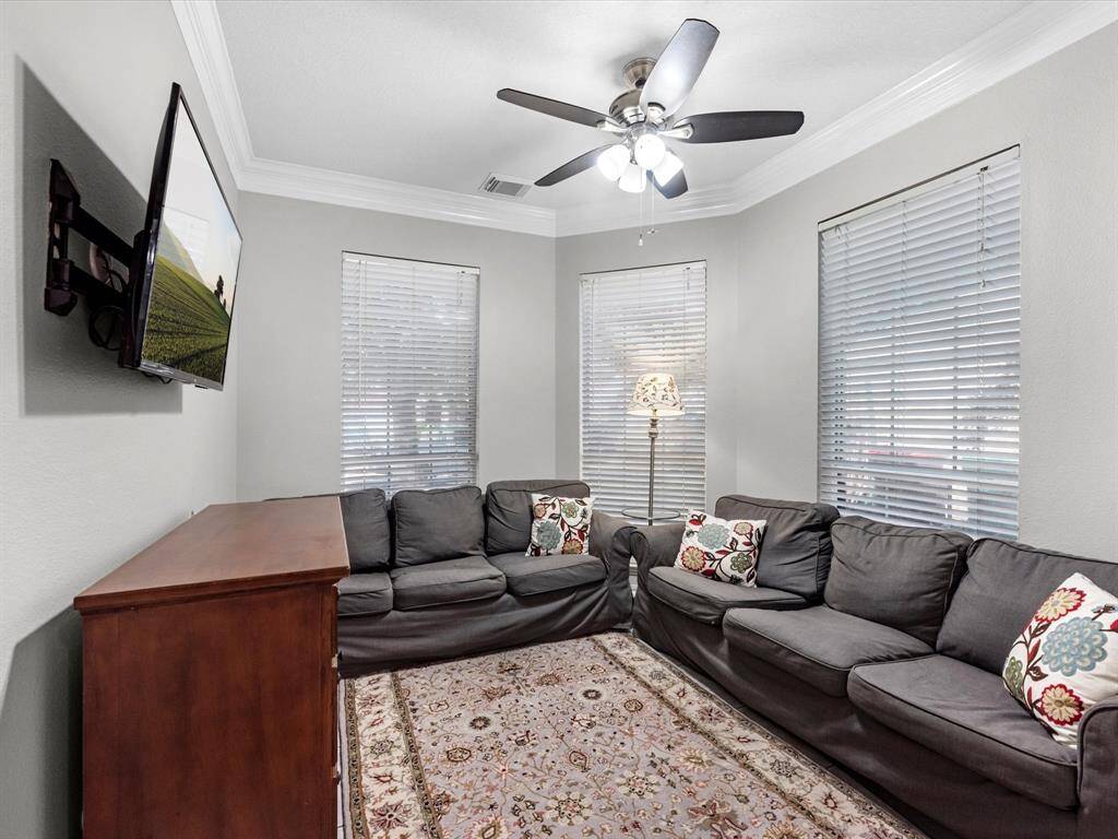 This room is also just off the kitchen. It makes a great flex space. Use for a separate sitting area or another home office.  It could also be used for a dining area if you prefer. This home is very versatile!