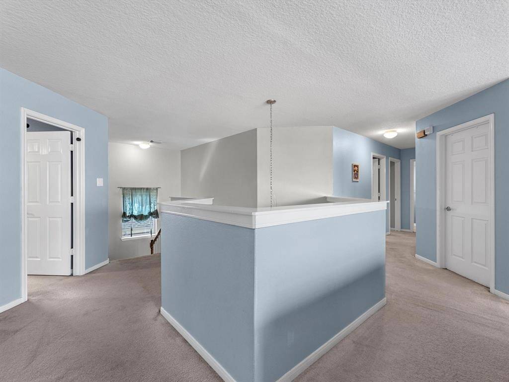 Coming up the stairs, there are 5 more bedrooms. Everyone has a space in this home!