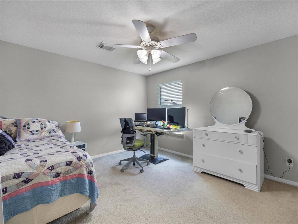 Another upstairs secondary bedroom.