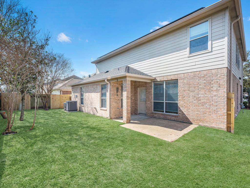 There's a covered patio to enjoy while the kids and pets play in the yard.