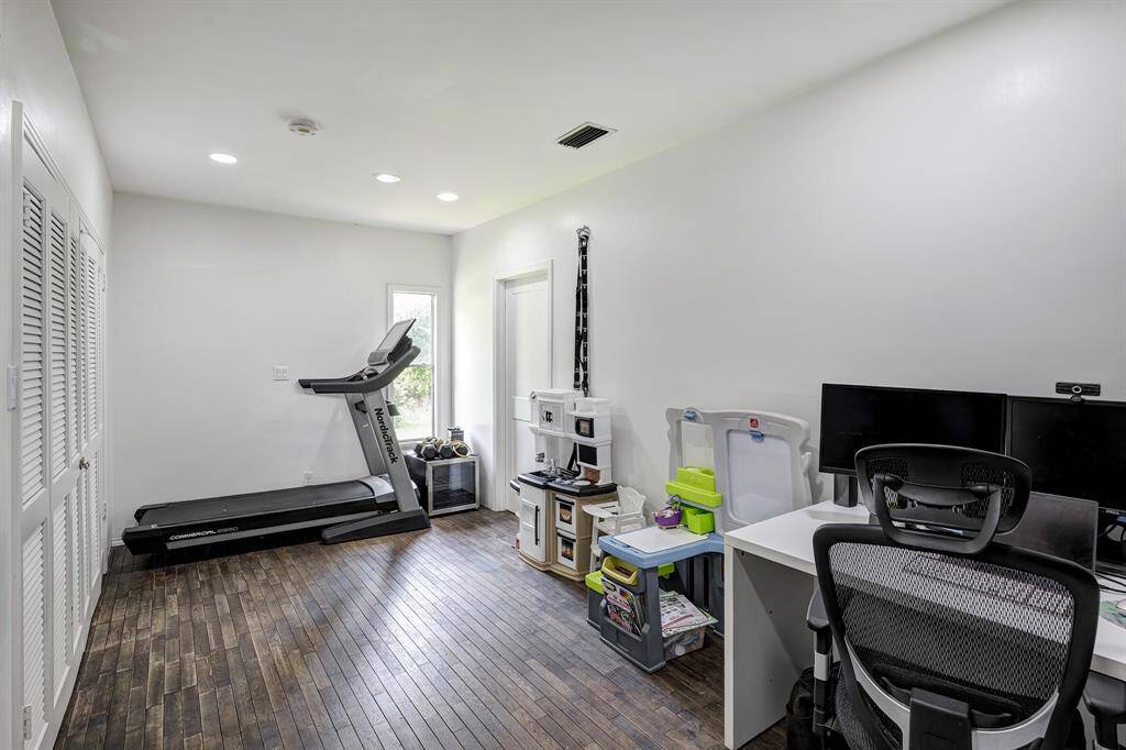 Currently used as office/gym.  Laundry is behind louvered doors on the left.
