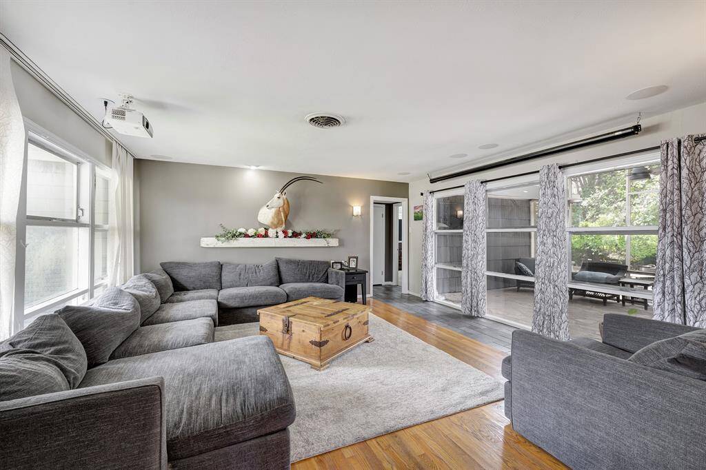Another view of the living space shows the view of the back porch.