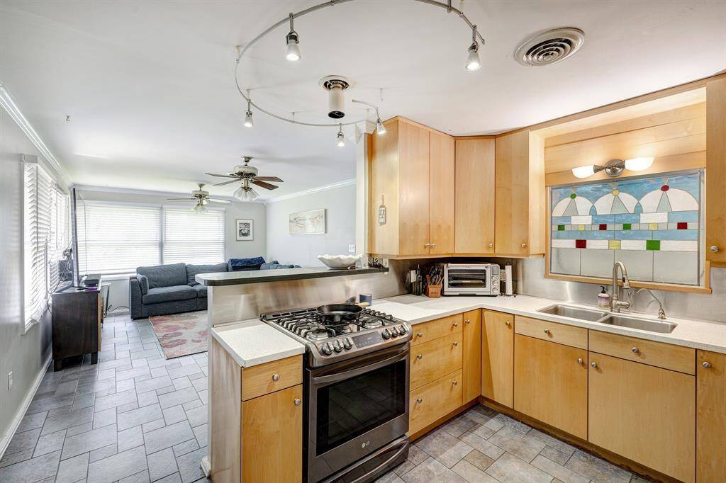 Another view of the kitchen looking onto the family room and back yard.
