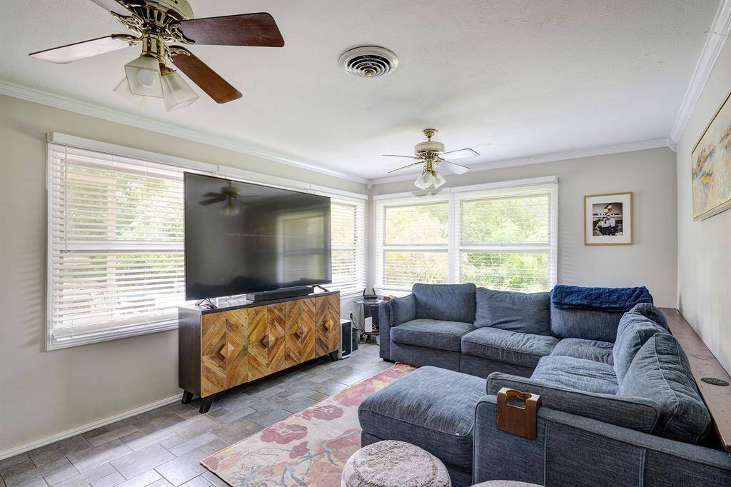 Family room which accesses the back yard, patio and pool.