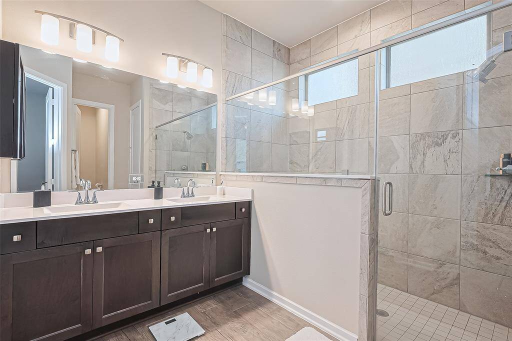 Primary bath with large walk in shower and double sinks