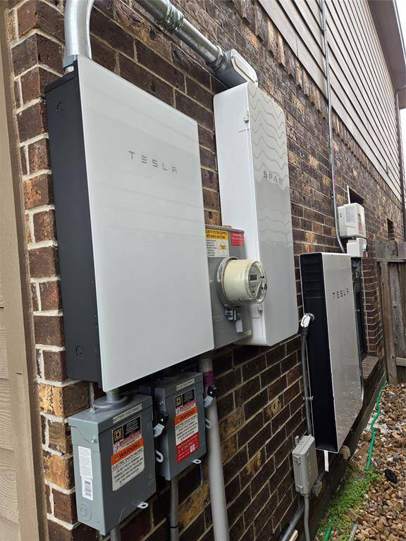 The other side of the home has the Tesla battery and the Tesla battery backup.