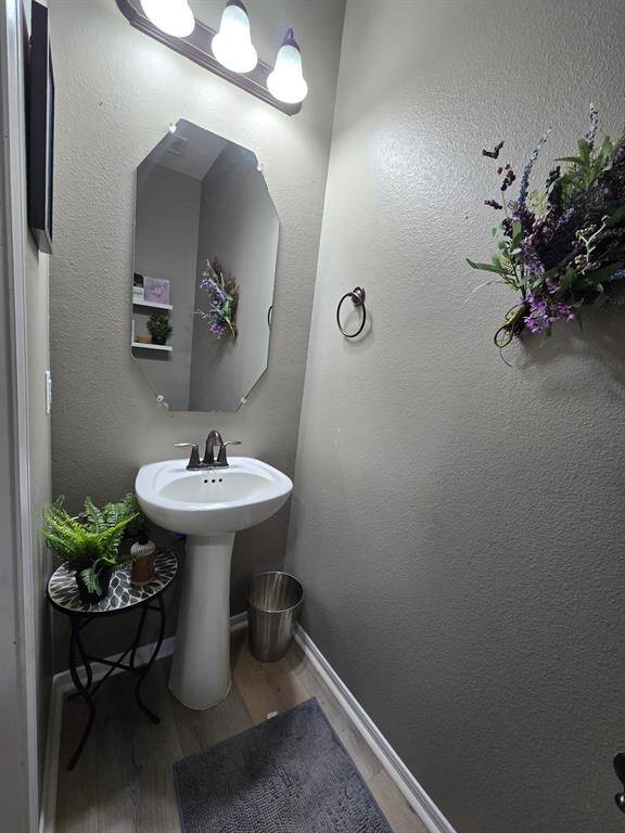 Powder room / half bath with pedicle sink.