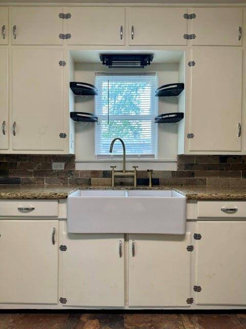 Apron sink and granite counter tops.