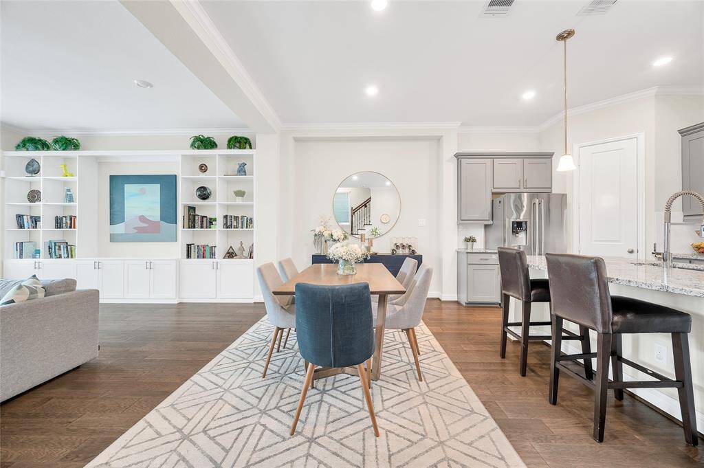 Open floor plan with a dining area that seamlessly flows into the kitchen and living space.
