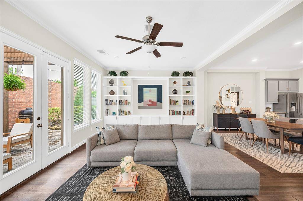 Spacious and airy living area with elegant French doors that open to your private backyard retreat.